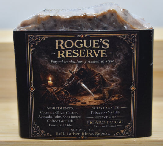 Bar of soap in a 'Rogue's Reserve' packaging on a wooden surface with a light blue background